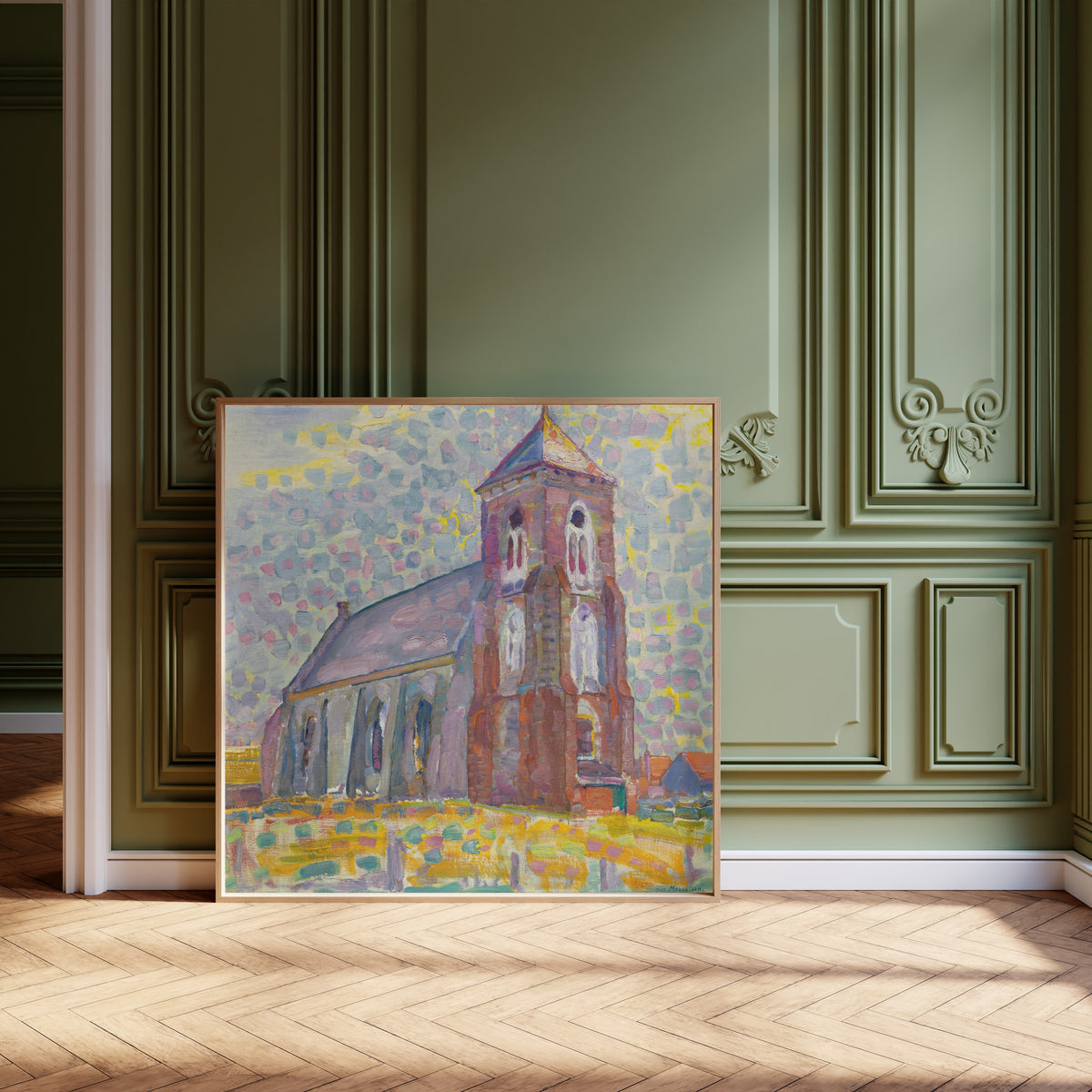 Framed art print of Church In Zoutelande by Piet Mondrian, leaning against olive-green panelling on a herringbone floor
