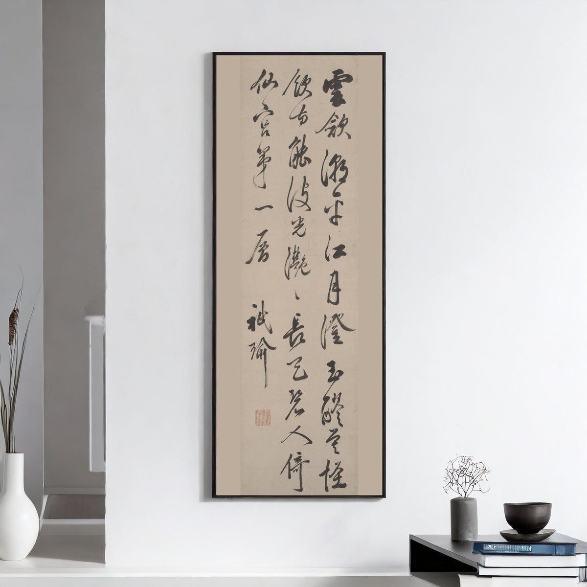 Clouds Recede by Gion Nankai — framed on a white wall above books and a bowl