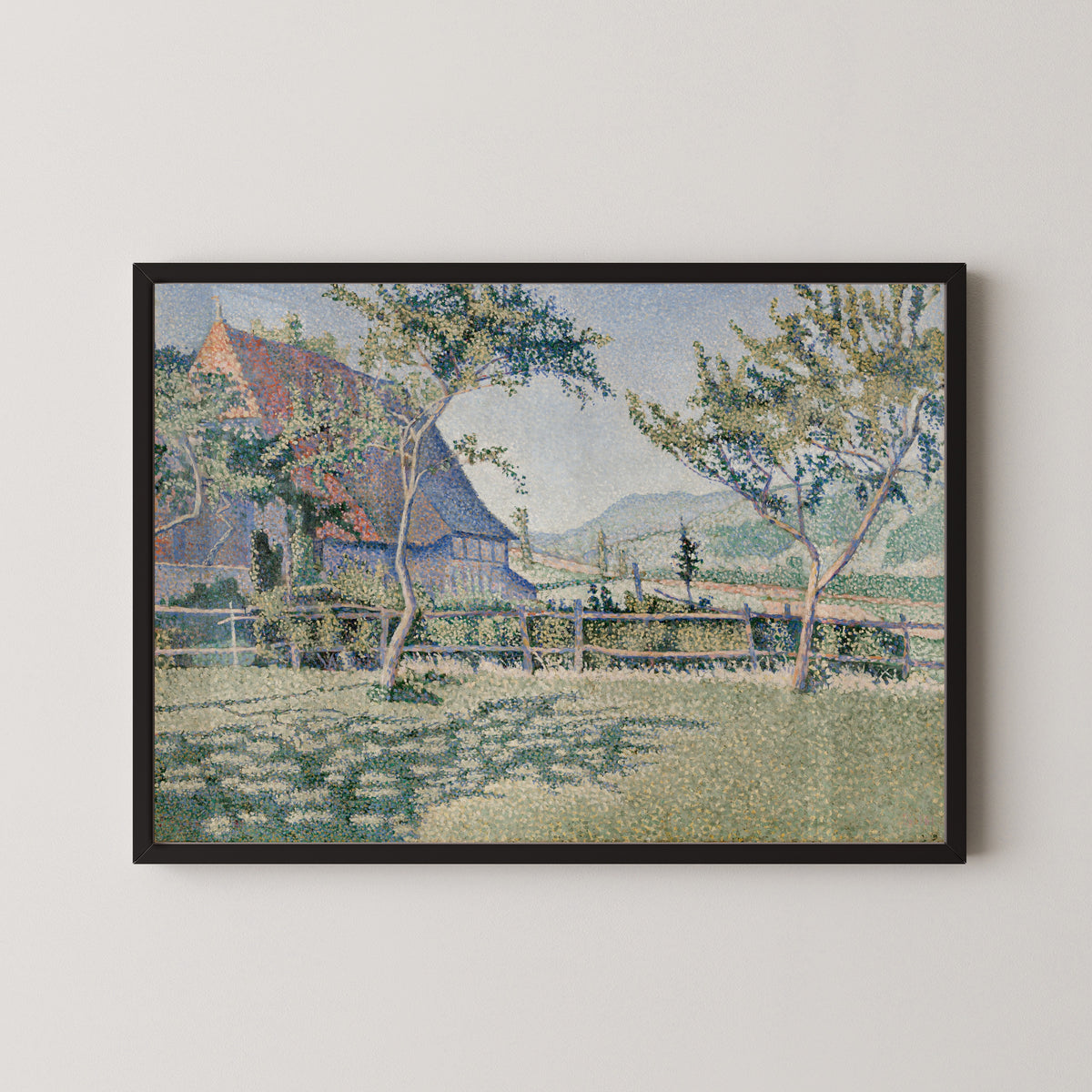 Framed art print of Comblat-le-Château, the Meadow by Paul Signac, in a black frame on a pale wall