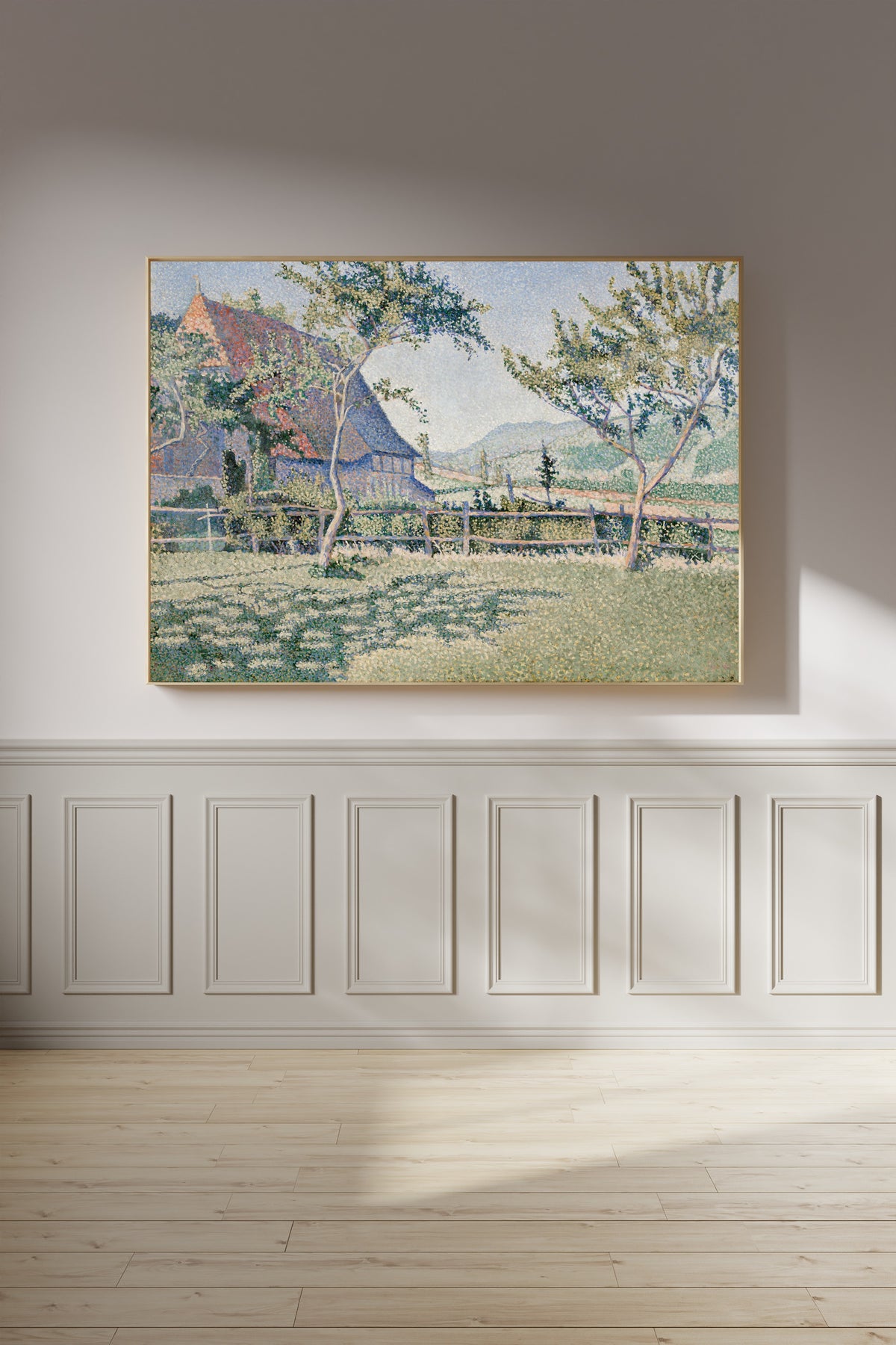 Framed art print of Comblat-le-Château, the Meadow by Paul Signac, on a panelled wall in afternoon light