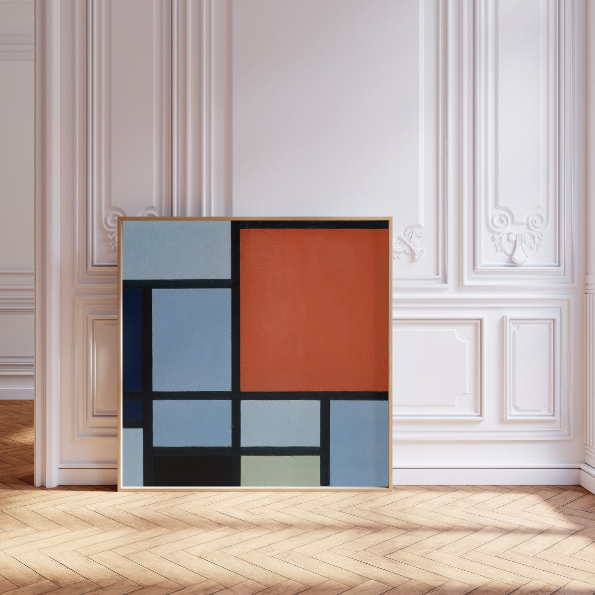 Framed art print of Composition (Red and Grey-Blue) by Piet Mondrian, leaning against pale pink panelling on a herringbone floor