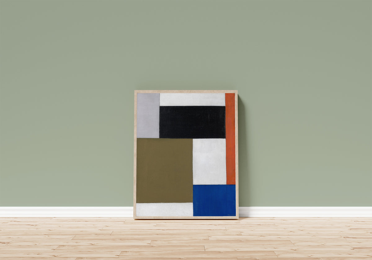 Framed art print of Composition by Theo van Doesburg, in a light wood frame leaning on a sage green wall above a wooden floor