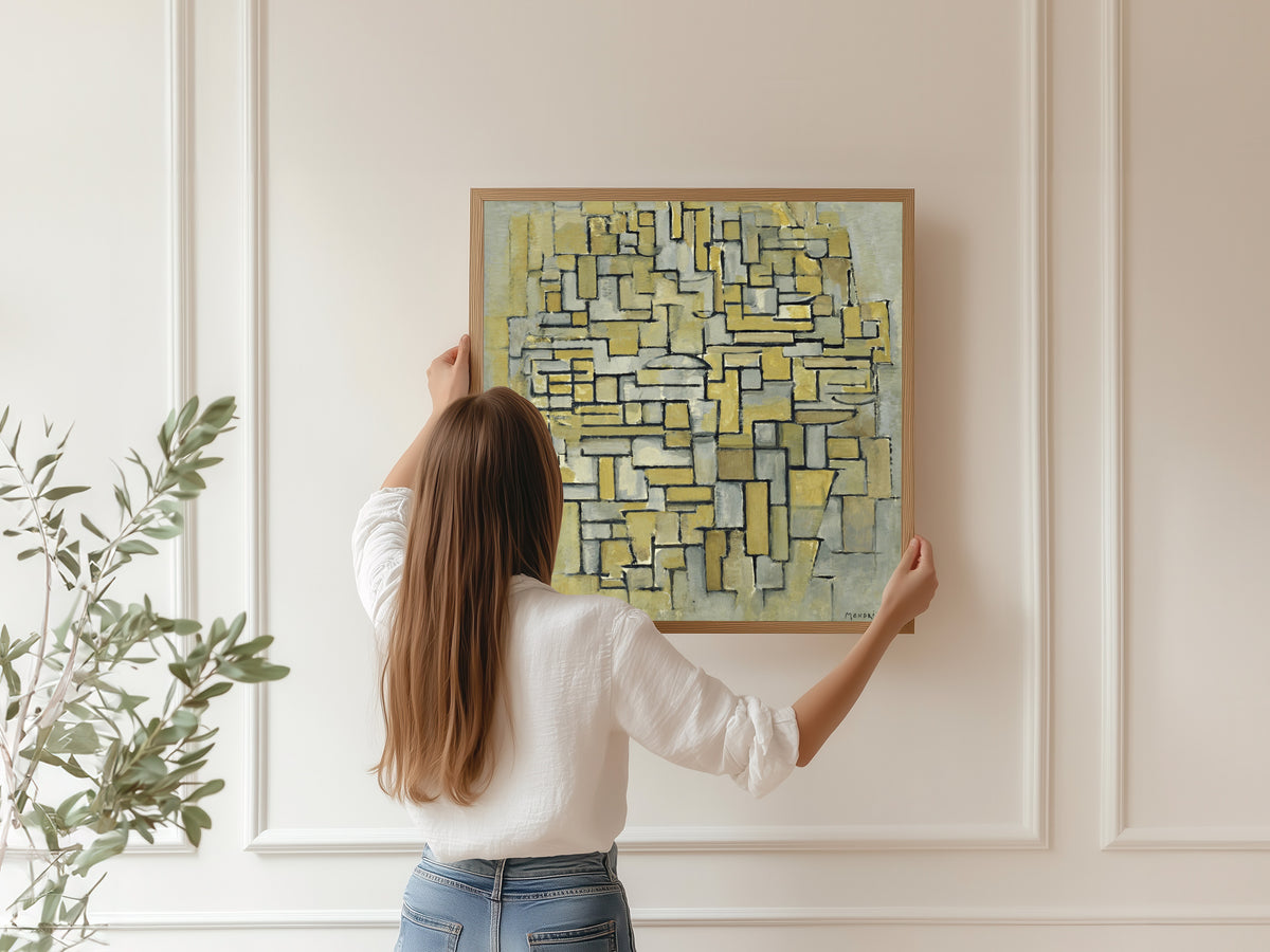 Framed art print of Composition in Brown and Grey by Piet Mondrian, hung on a panelled wall