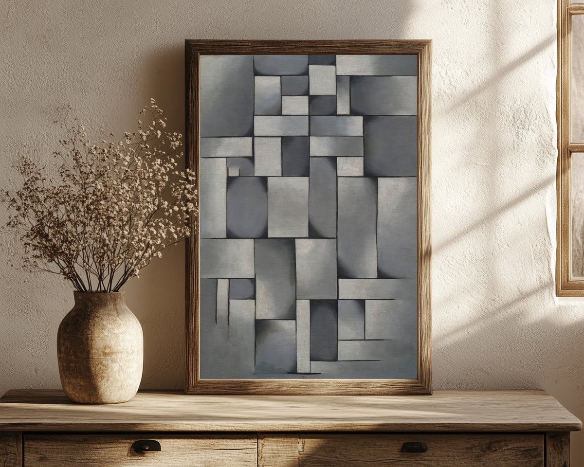 Framed art print of Composition in Gray (Rag-time). by Theo van Doesburg, in a dark wood frame leaning on a rustic console beside dried flowers