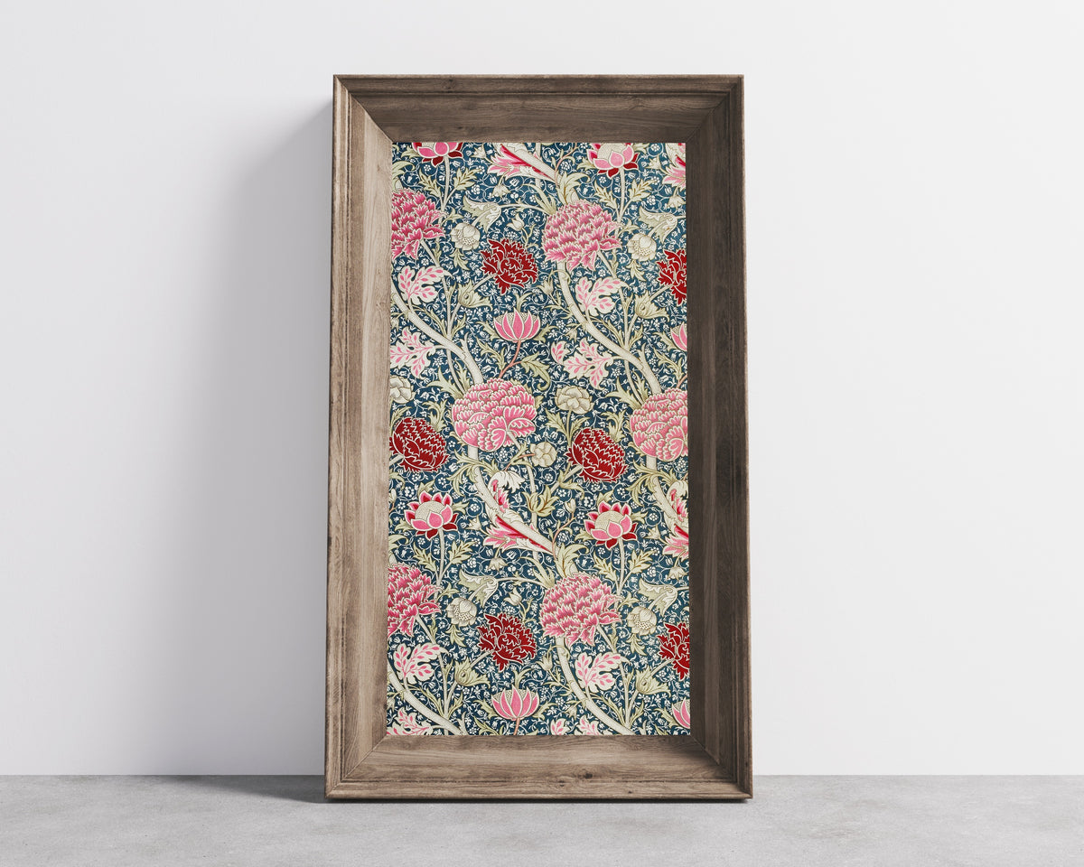 Framed art print of Cray by William Morris, in a wide wooden frame leaning against a concrete wall