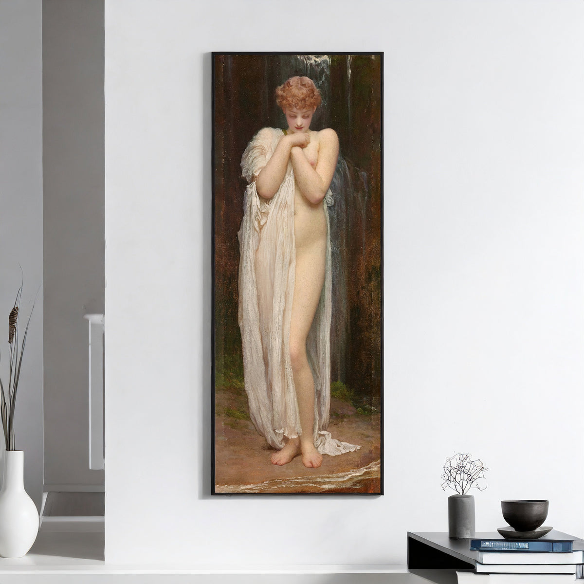 Framed art print of Crenaia, the Nymph of the Dargle by Frederic Leighton, on a white wall above books and a bowl