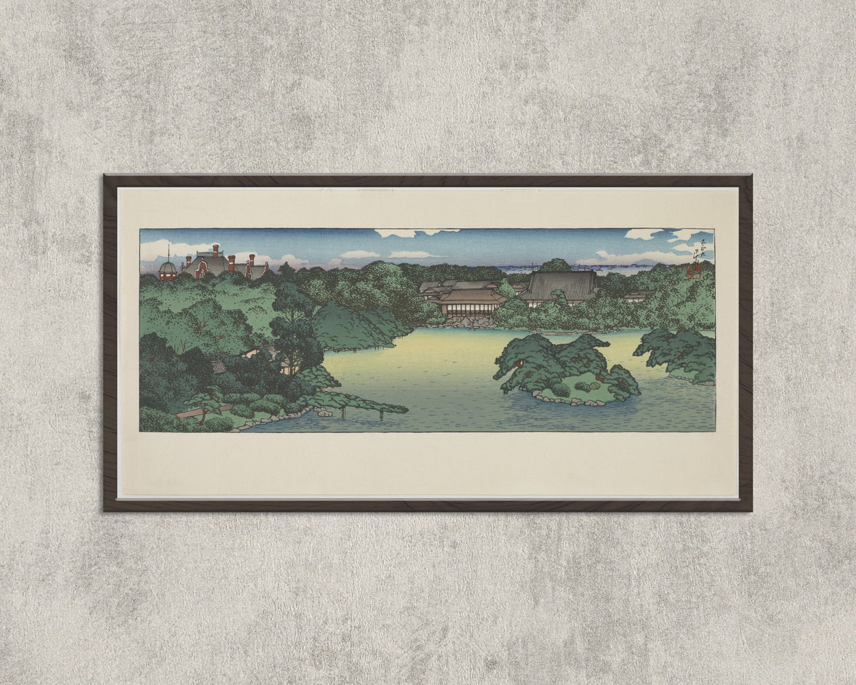 Framed art print of Daisensui Pond, Mitsubishi Villa at Fukagawa by Kawase Hasui, in a wide black frame on a concrete wall
