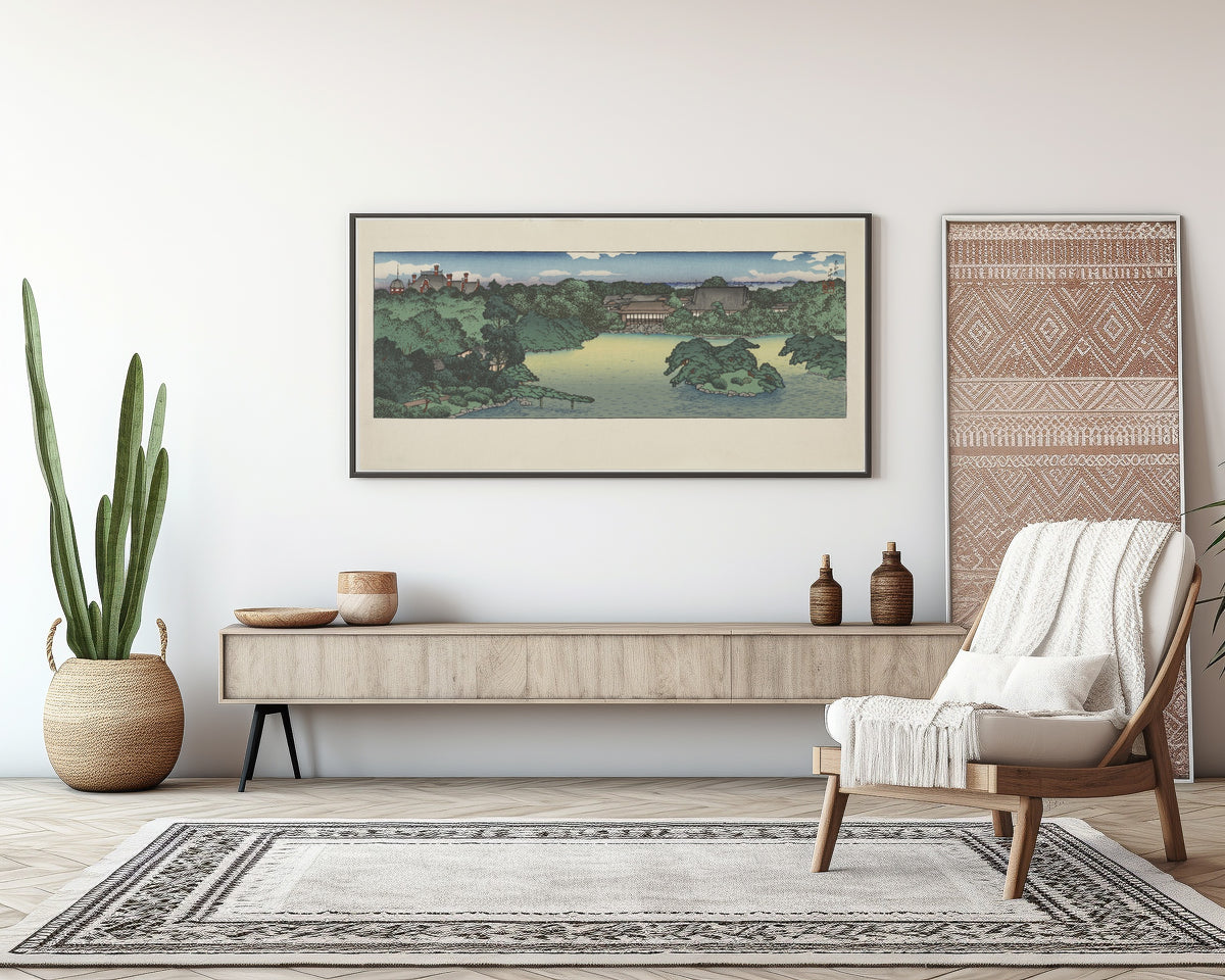 Framed art print of Daisensui Pond, Mitsubishi Villa at Fukagawa by Kawase Hasui, above a sideboard in a living room