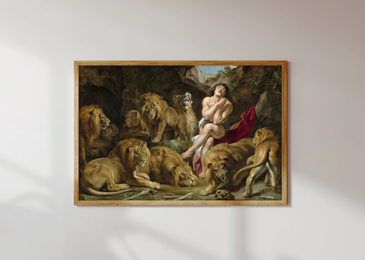 Framed art print of Daniel in the Lions' Den by Peter Paul Rubens, in a light wood frame on a sunlit white wall