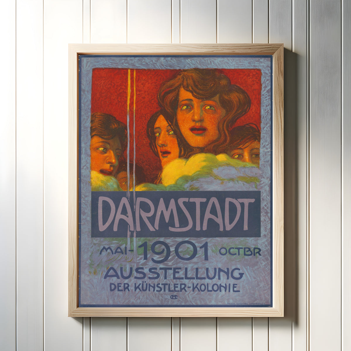Framed art print of Darmstadt 1901: Ausstellung der Künstler-Kolonie by Hans Christiansen, in a light wood frame on a white panelled wall