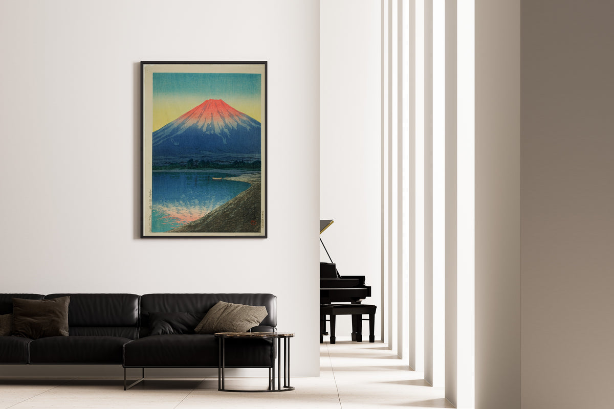Framed art print of Daybreak over Lake Yamanaka by Kawase Hasui, on the wall of a minimal living room