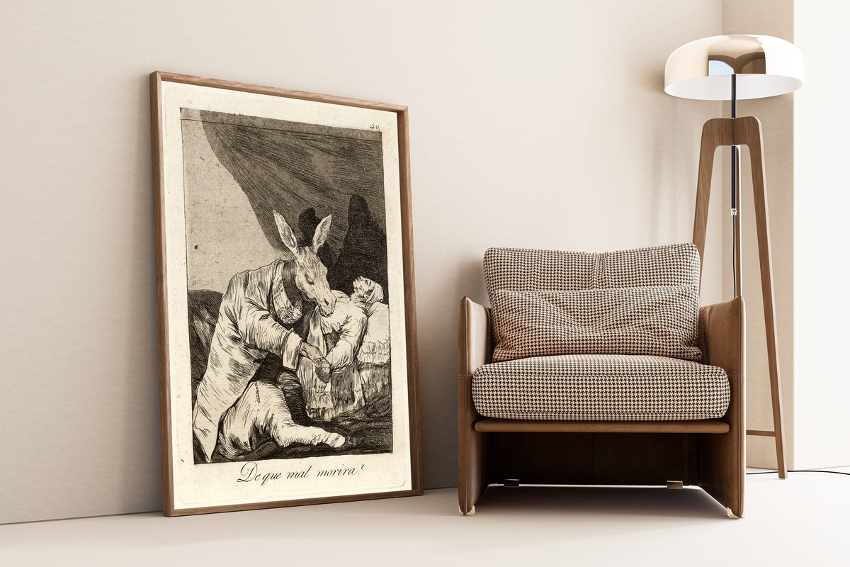 Framed art print of De que mal morira? (Of What Ill Will He Die?), Los… by Francisco de Goya, leaning against a wall beside an armchair and a floor lamp