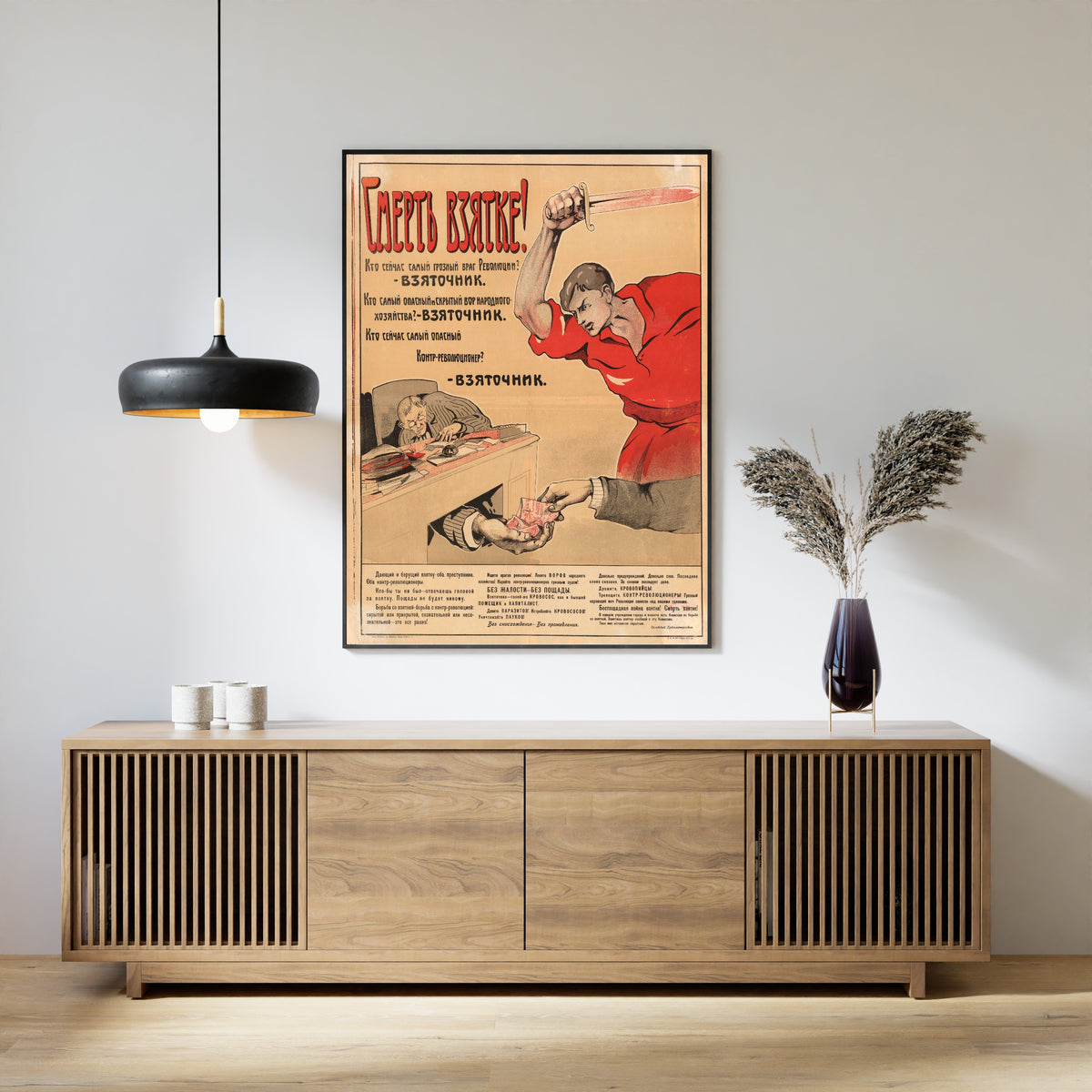 Framed art print of Death to Bribery!, above a slatted wood sideboard