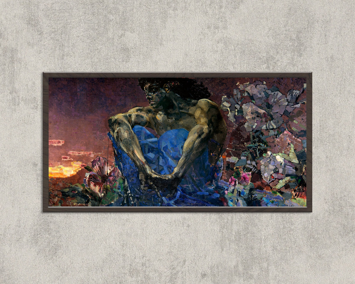 Framed art print of Demon Seated by Mikhail Vrubel, in a wide black frame on a concrete wall
