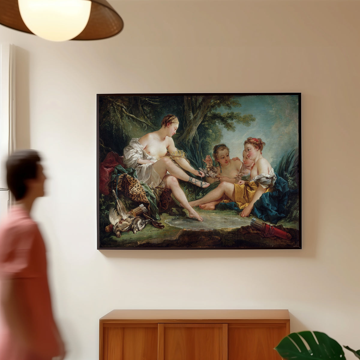 Framed art print of Diana Returning from the Hunt by François Boucher, in a slim black frame on a warm wall in a sunlit room