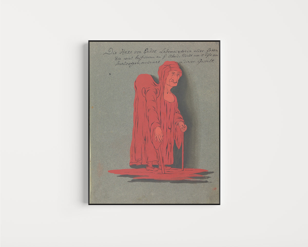 Framed art print of Die Hexe von Endor, Lehrmeisterin aller Hexen by Unknown artist, in a slim black frame on a plain white wall