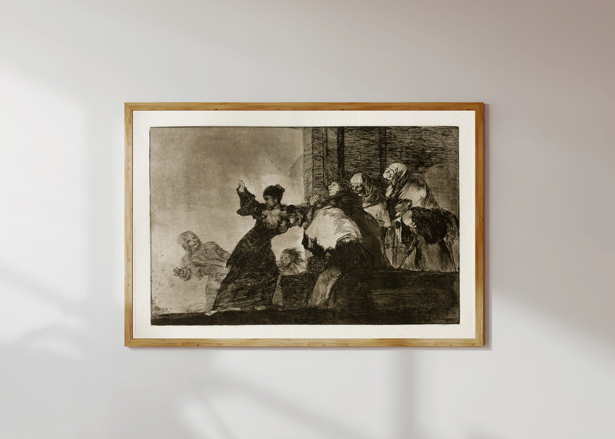 Framed art print of Disparate pobre (Poor Folly), from Los Disparates by Francisco de Goya, in a light wood frame on a sunlit white wall