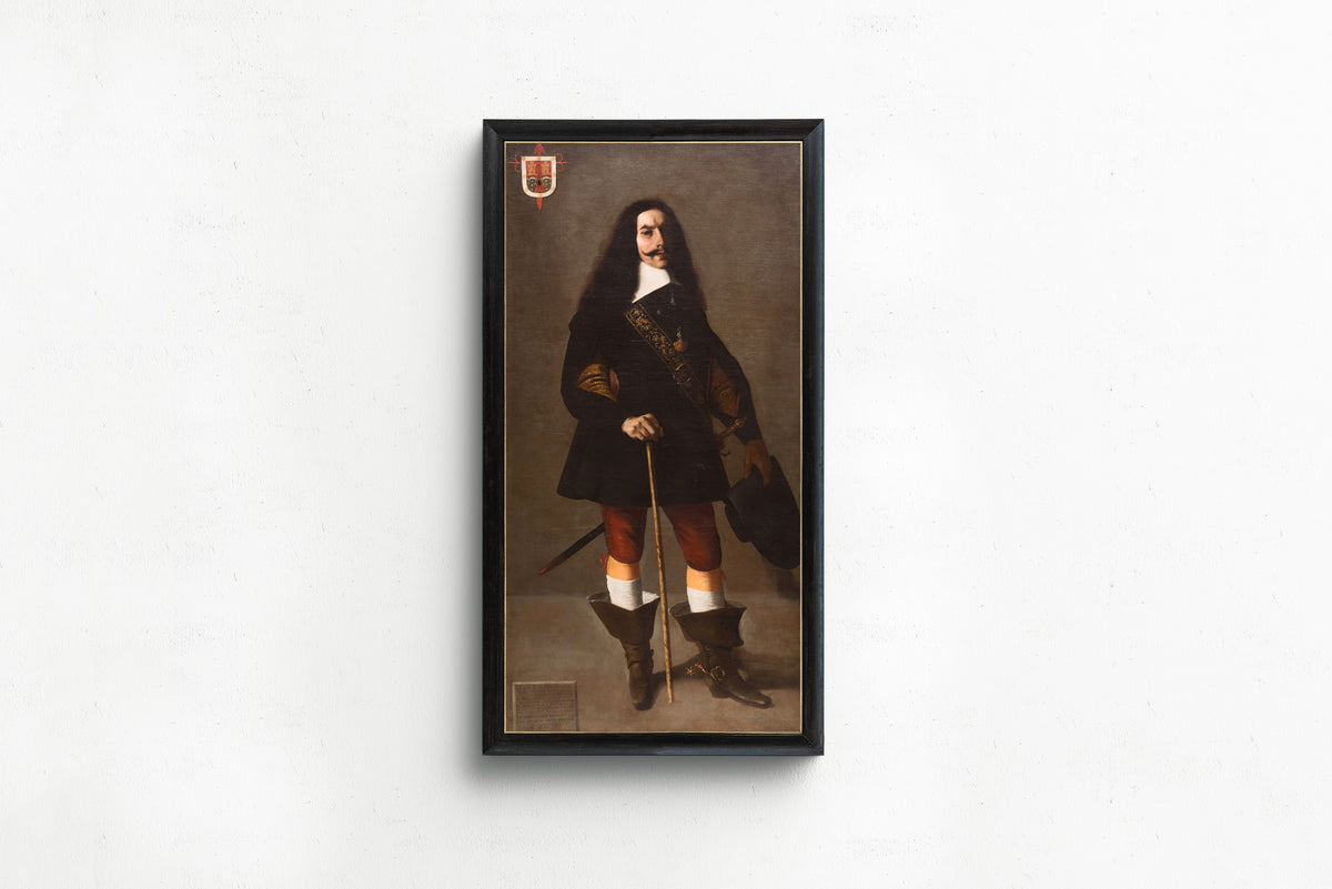 Framed art print of Don Juan Bazo de Moreda by Francisco de Zurbarán, in a slim black frame on a plain white wall