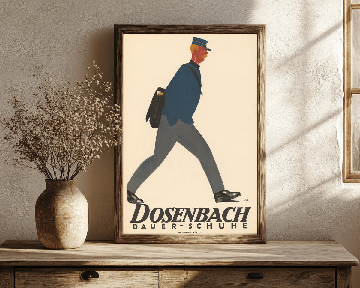 Framed art print of Dosenbach: Dauer-Schuhe by Emil Cardinaux, in a dark wood frame leaning on a rustic console beside dried flowers
