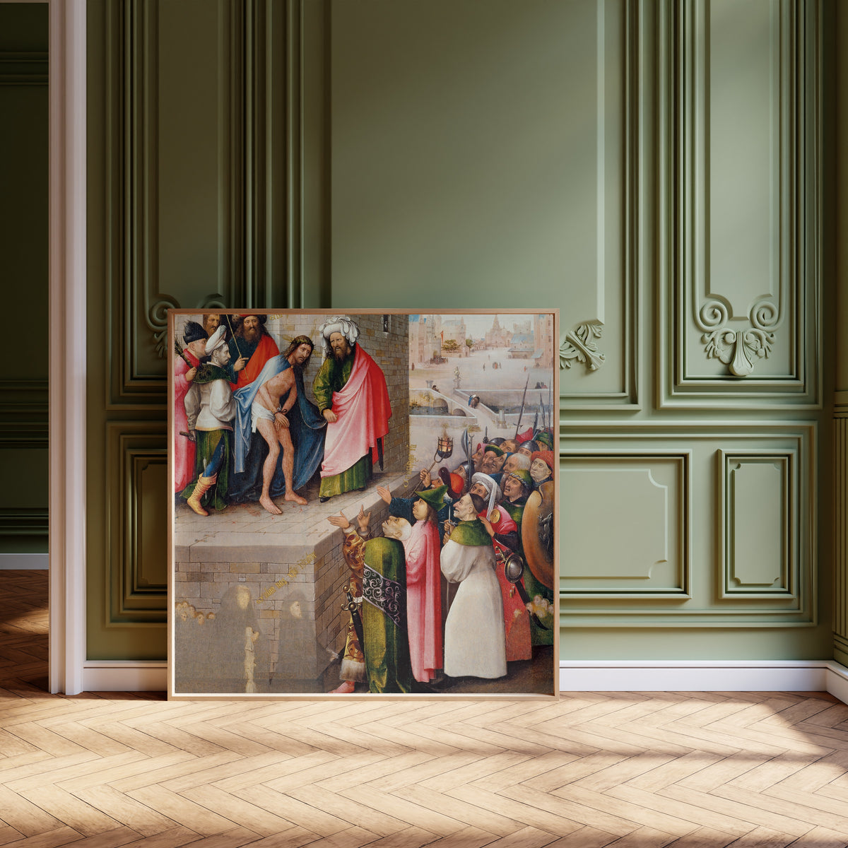 Framed art print of Ecce Homo by Hieronymus Bosch, leaning against olive-green panelling on a herringbone floor