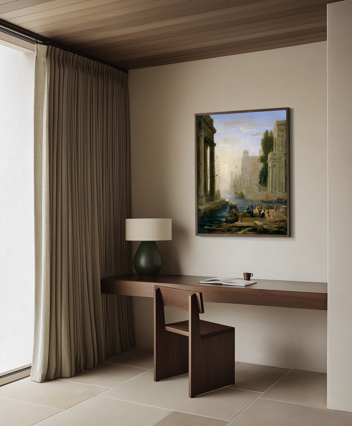 Framed art print of Embarkation of St Paula by Claude Lorrain, in a dark wood frame on a plaster wall above a walnut desk