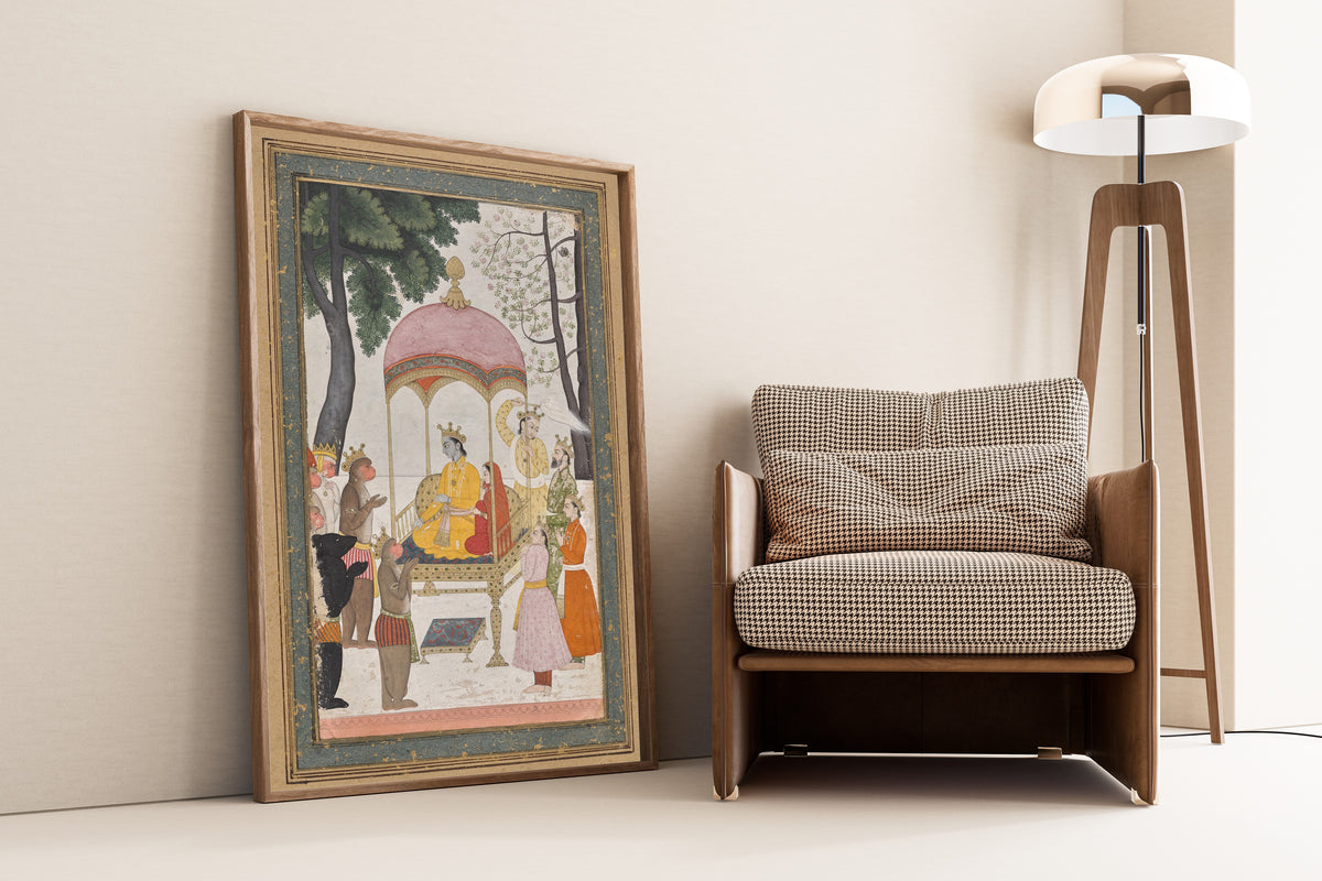 Framed art print of Enthroned Rama and Sita Receive Homage from their Monkey and… by Pahari school, leaning against a wall beside an armchair and a floor lamp