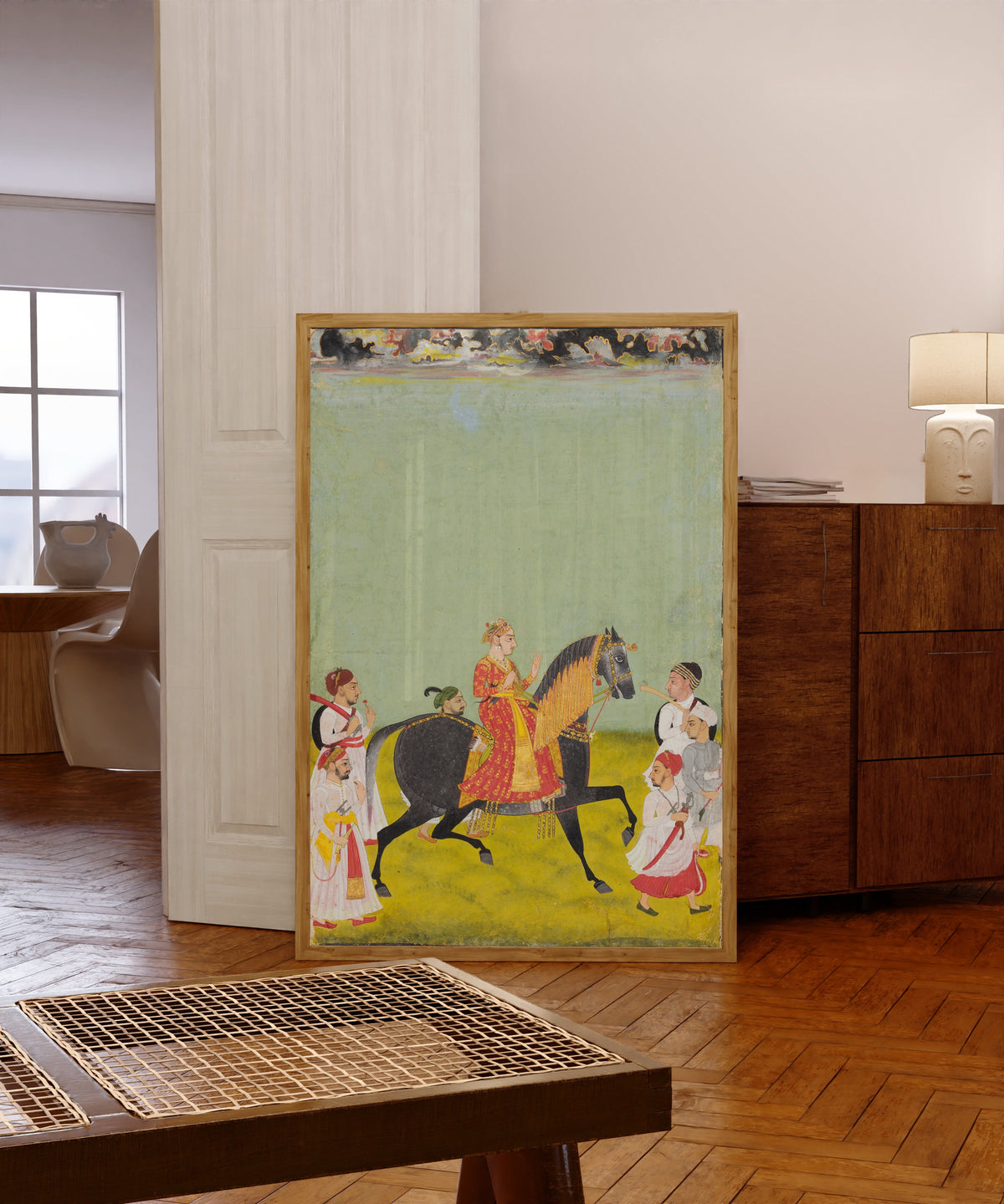 Framed art print of Equestrian Portrait of Maharana Raj Singh II of Mewar… by Mewar school, in a light wood frame leaning in a warm room with a parquet floor