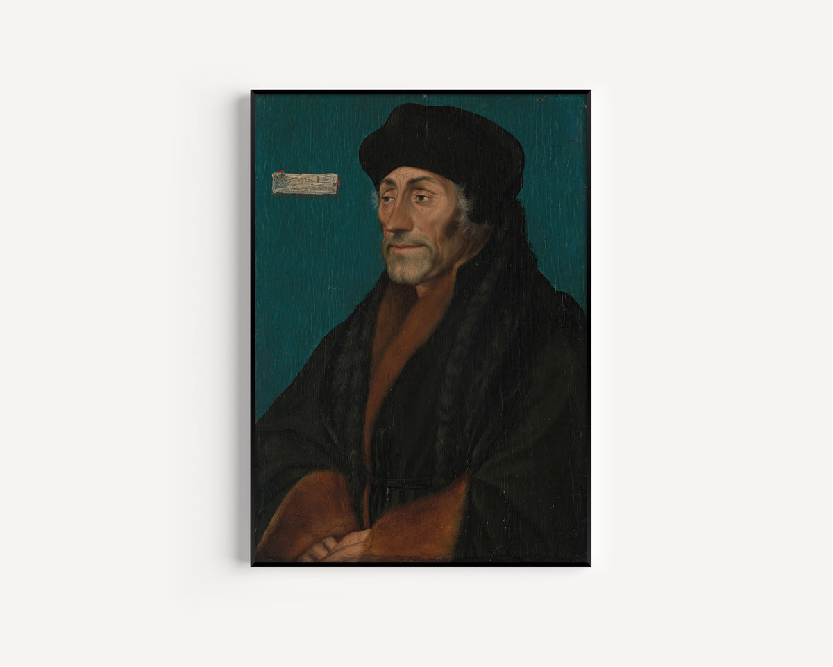 Framed art print of Erasmus of Rotterdam by Hans Holbein the Younger, in a slim black frame on a plain white wall