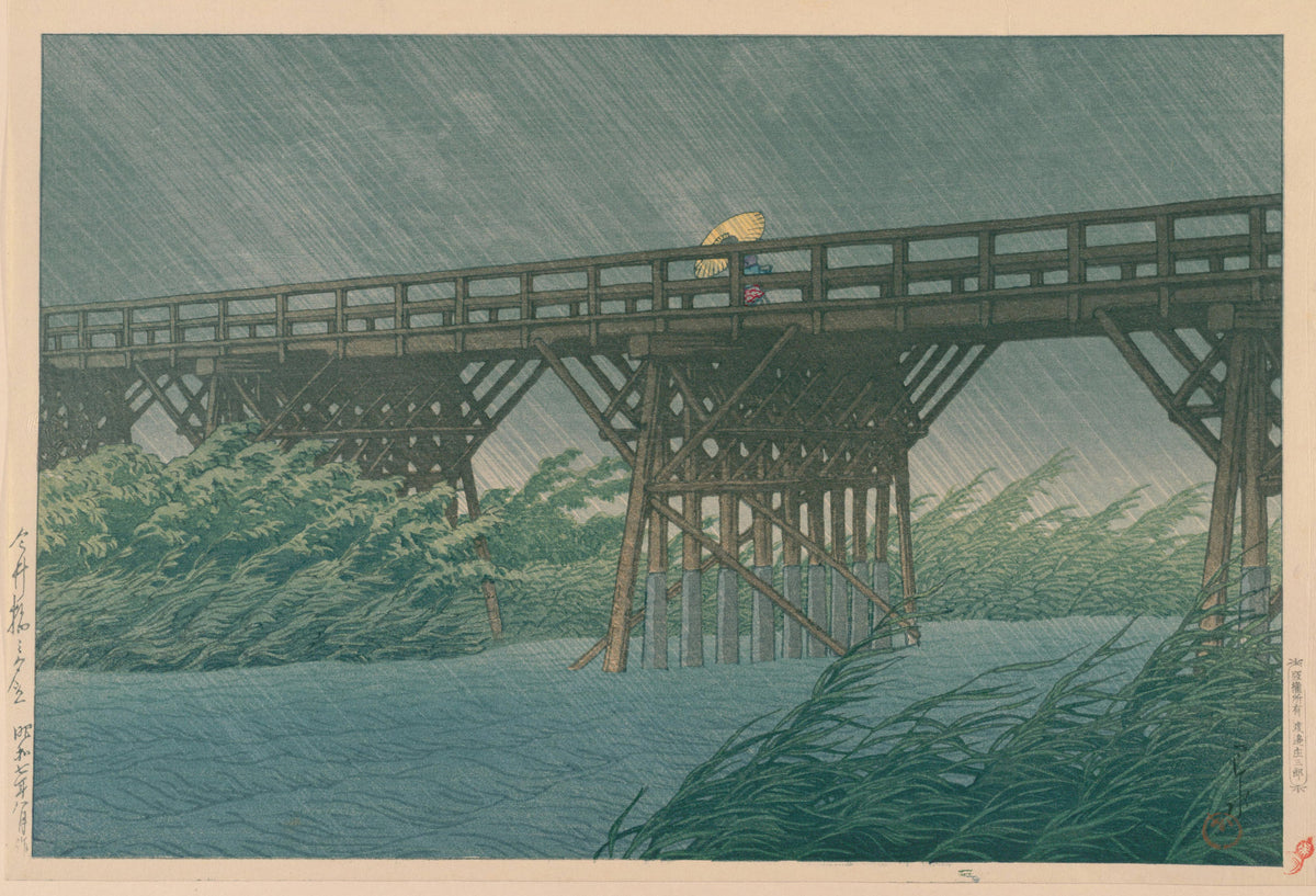 Evening Shower at Imai Bridge by Kawase Hasui — Rain lashing a long bridge as a yellow umbrella crosses