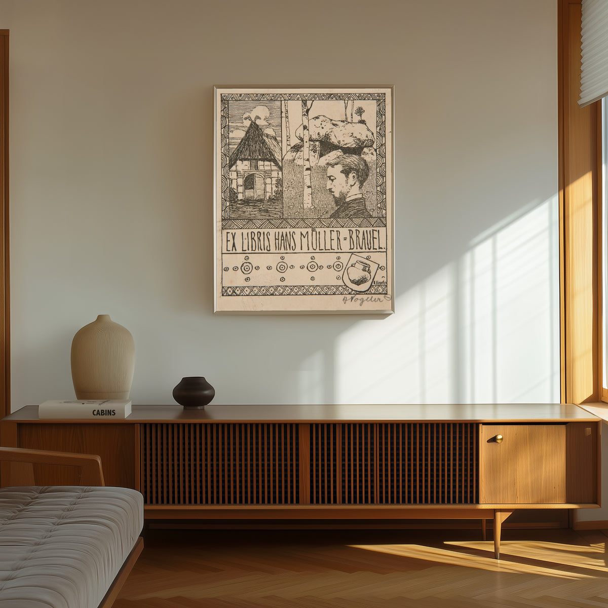 Framed art print of Ex Libris Hans Müller-Brauel by Heinrich Vogeler, in a thin light frame on a sunlit wall above a wooden sideboard