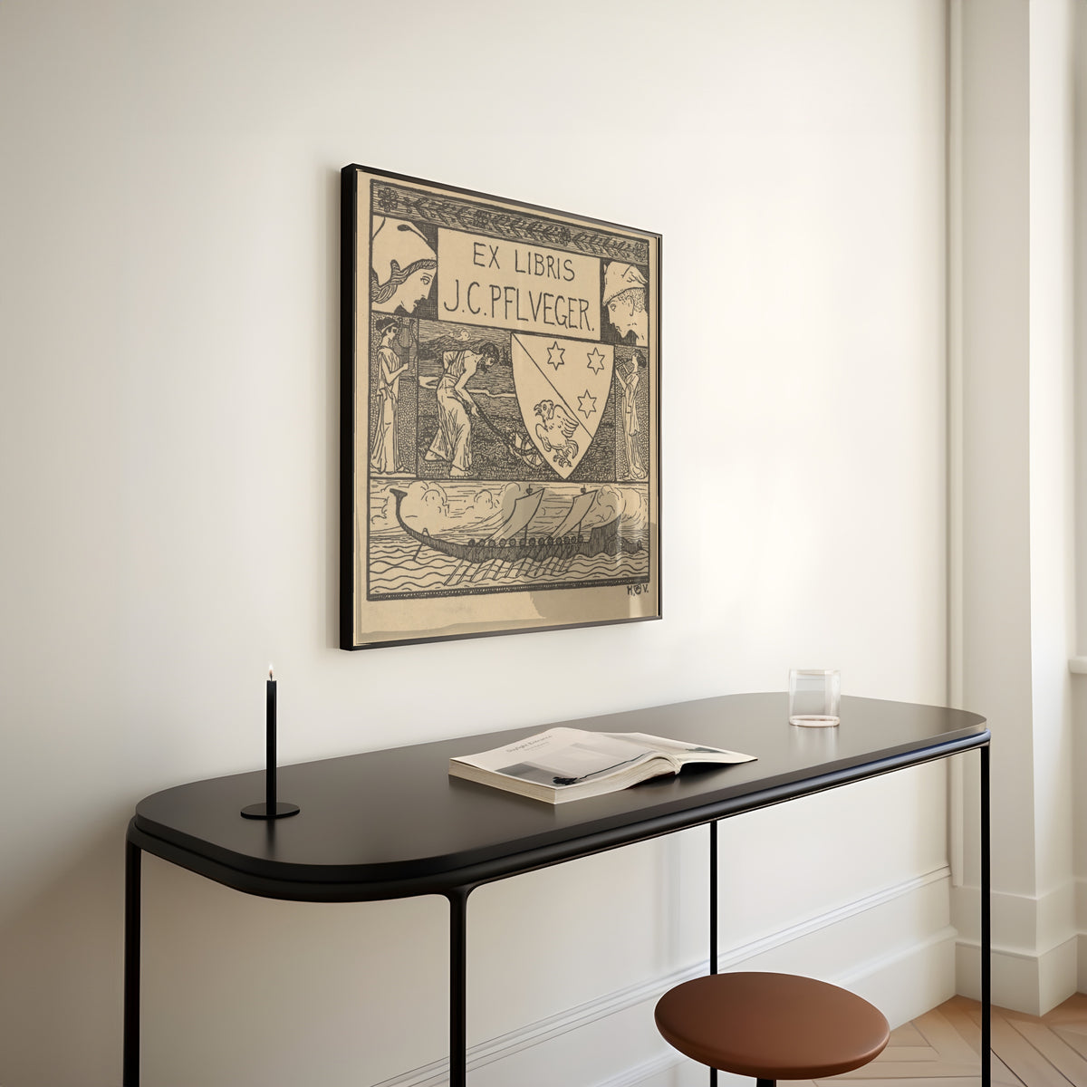 Framed art print of Ex Libris J.C. Pflueger by Heinrich Vogeler, above a slim black console table