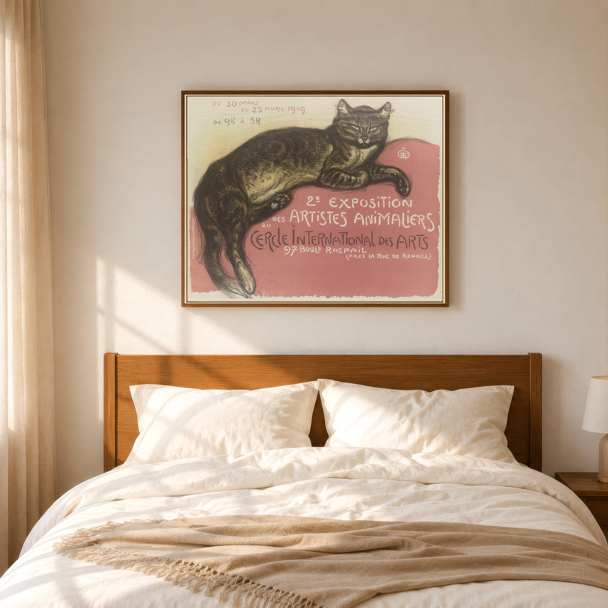 Framed art print of Exposition des artistes animaliers au Cercle International des… by Théophile Steinlen, in a slim wood frame above a bed in a sunlit bedroom