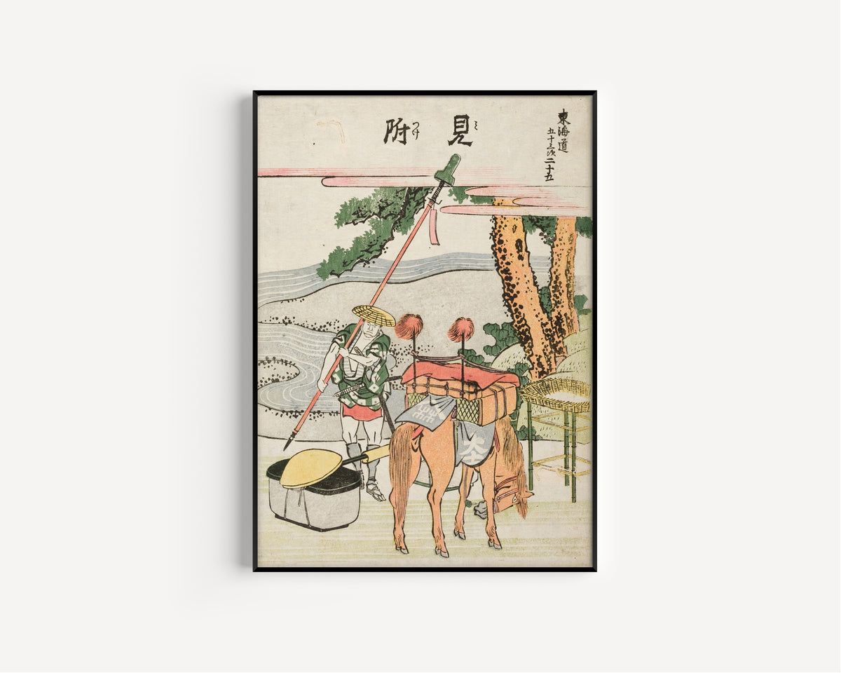 Framed art print of Fifty-three Stations of the Tōkaidō: Mitsuke by Katsushika Hokusai, in a slim black frame on a plain white wall