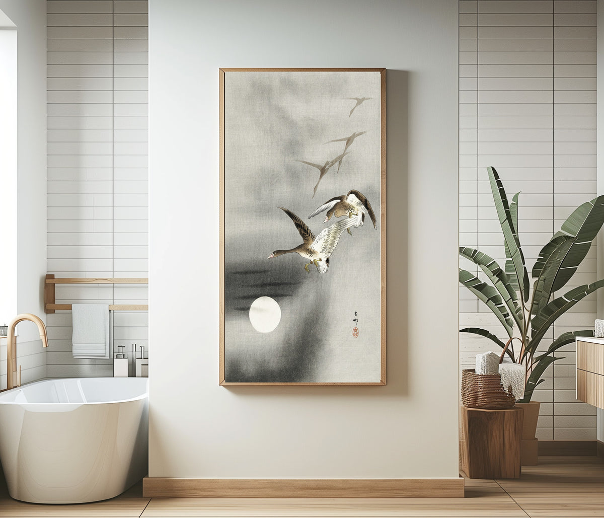 Framed art print of Five Geese in Flight at Full Moon by Ohara Koson, in a bathroom beside a freestanding tub