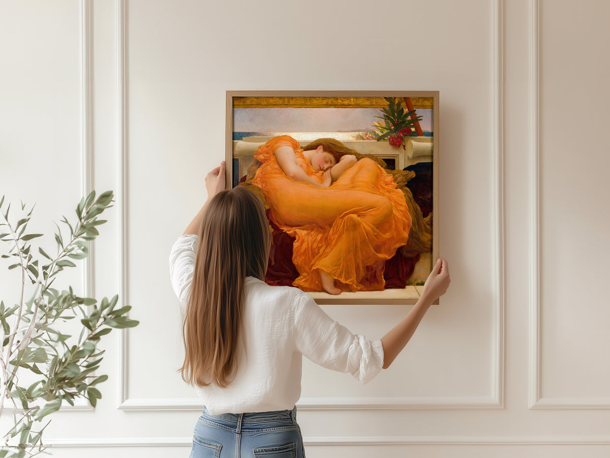 Framed art print of Flaming June by Frederic Leighton, hung on a panelled wall