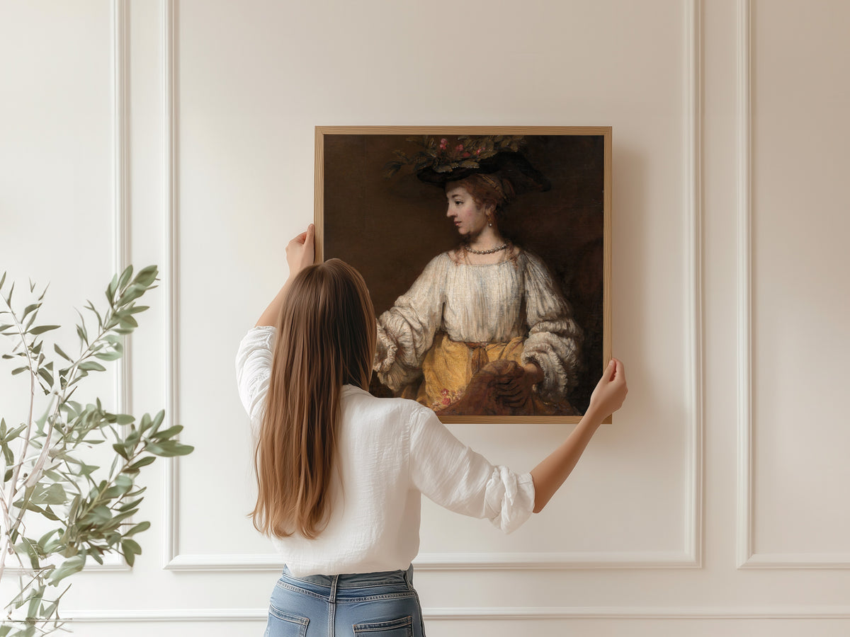Framed art print of Flora by Rembrandt van Rijn, hung on a panelled wall
