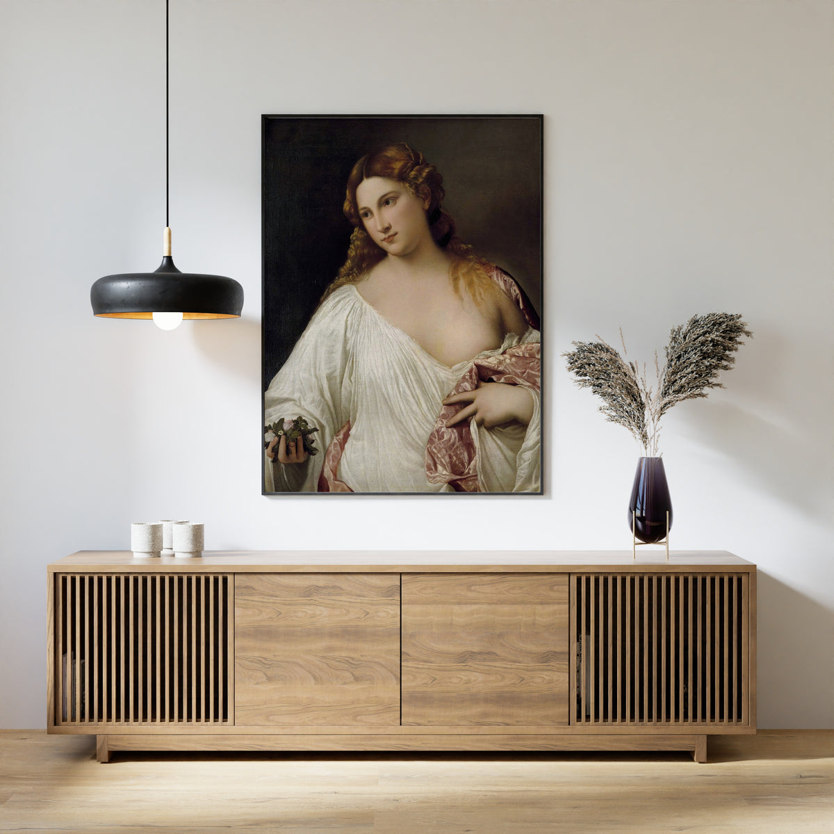 Framed art print of Flora by Titian, above a slatted wood sideboard