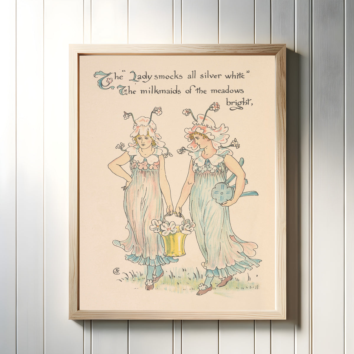 Framed art print of Flora's Feast: Lady-smocks by Walter Crane, in a light wood frame on a white panelled wall