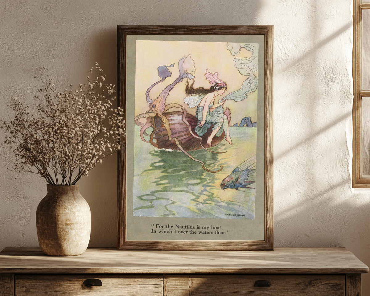Framed art print of For the Nautilus is my boat in which I over the… by Warwick Goble, in a dark wood frame leaning on a rustic console beside dried flowers