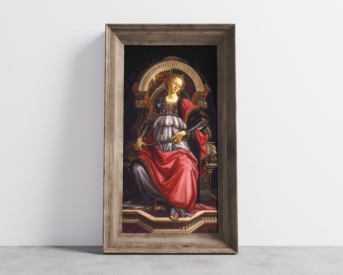 Framed art print of Fortitude by Sandro Botticelli, in a wide wooden frame leaning against a concrete wall
