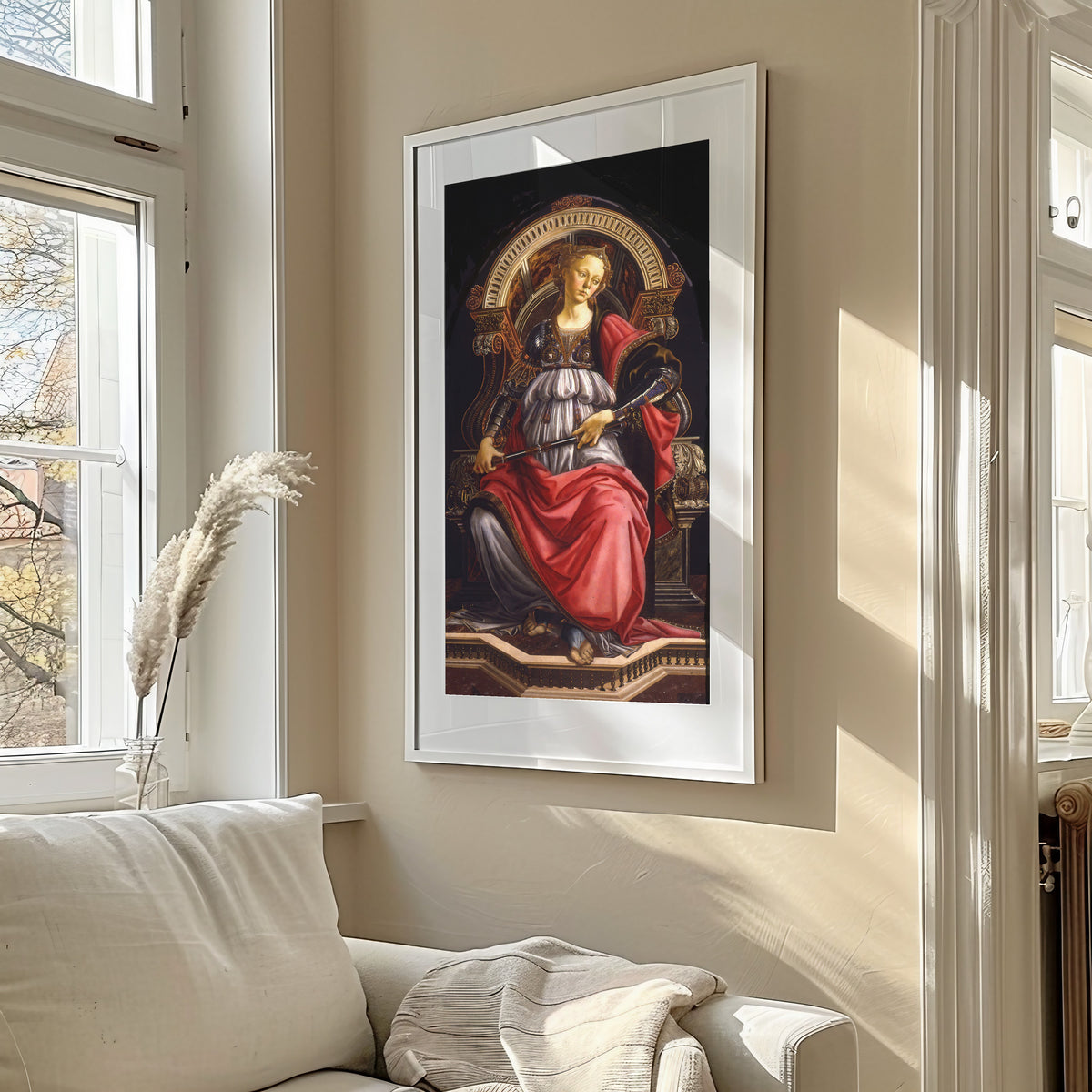 Framed art print of Fortitude by Sandro Botticelli, in a sunlit living room above a sofa