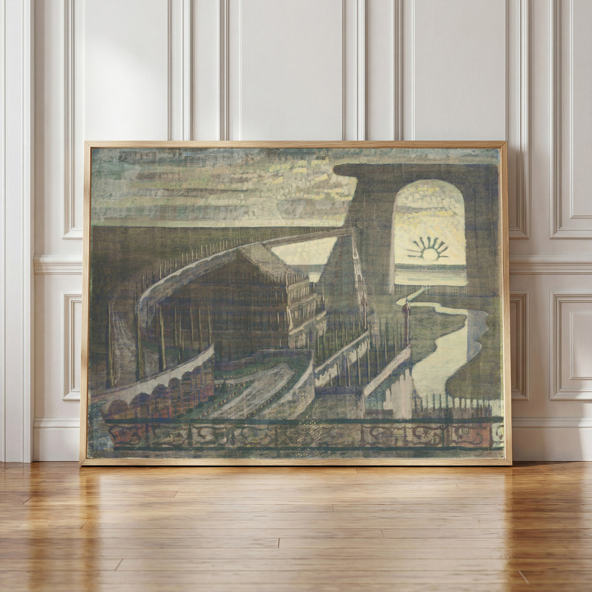 Framed art print of Fortress by Mikalojus Konstantinas Čiurlionis, in a light wood frame leaning against a panelled white wall