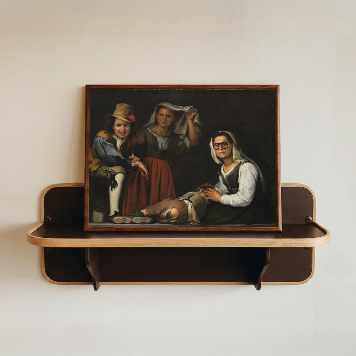 Framed art print of Four Figures on a Step by Bartolomé Esteban Murillo, in a dark wood frame resting on a wall shelf