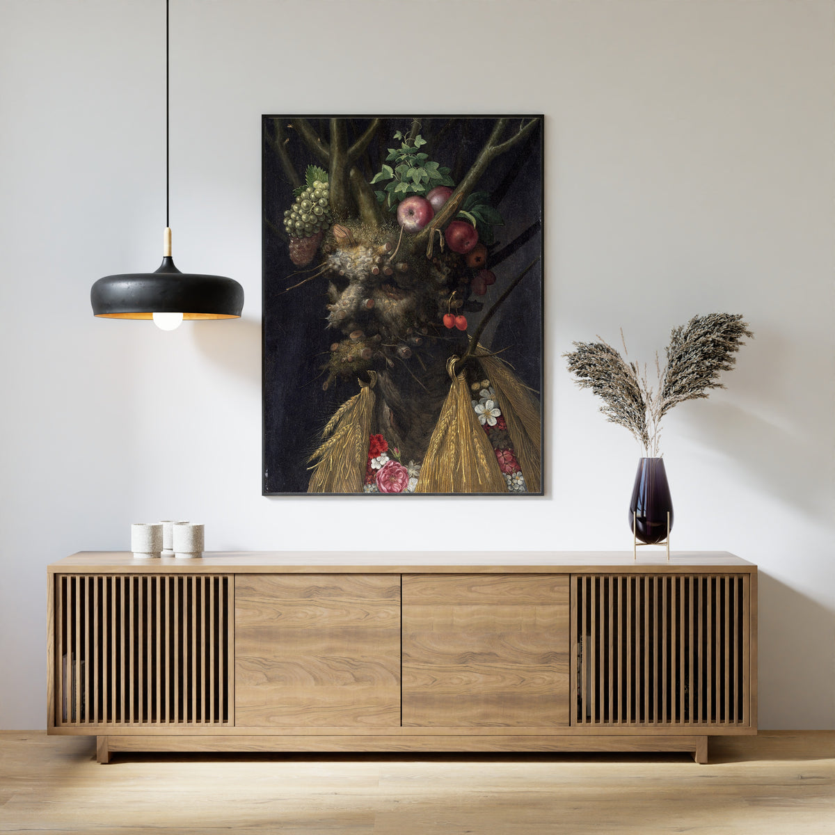 Framed art print of Four Seasons in One Head by Giuseppe Arcimboldo, above a slatted wood sideboard