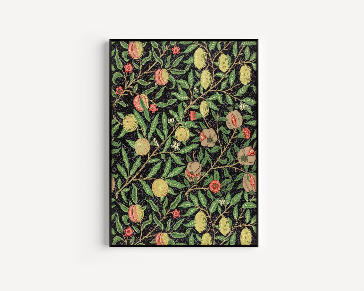 Framed art print of Fruit by William Morris, in a slim black frame on a plain white wall