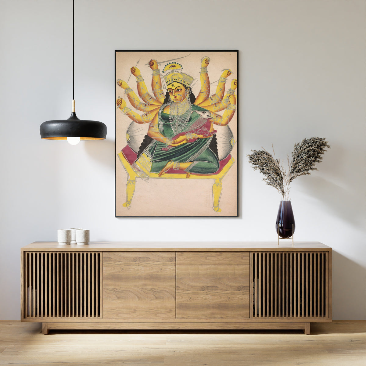 Framed art print of Ganesha-Janani (Mother of Ganesh) by Kalighat painter, above a slatted wood sideboard