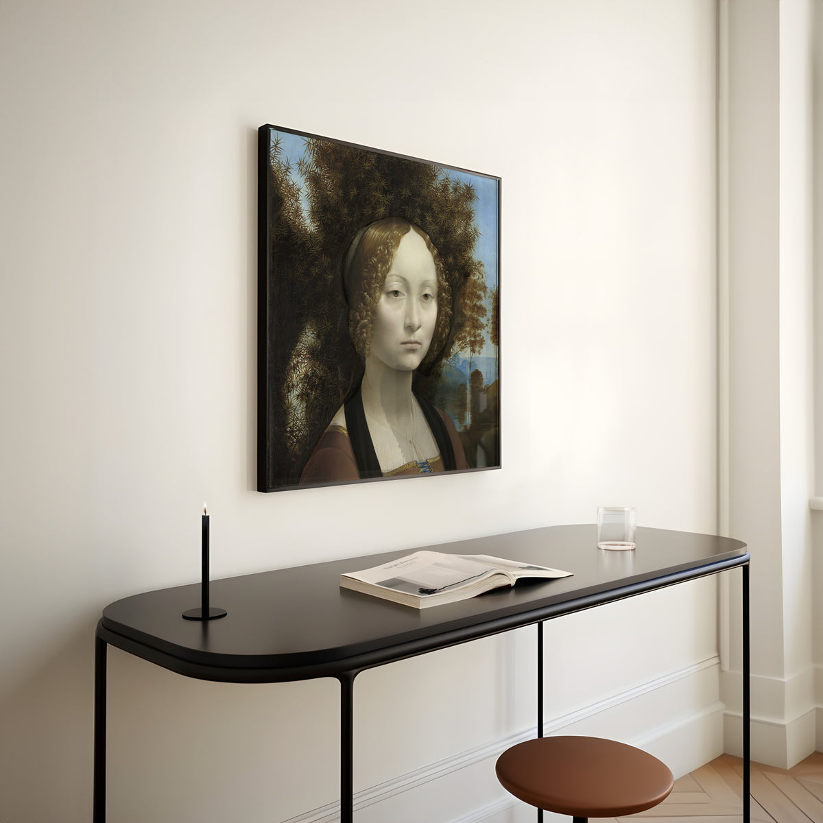 Framed art print of Ginevra de’ Benci by Leonardo da Vinci, above a slim black console table