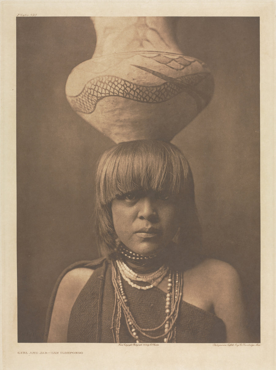 Edward S. Curtis — Girl and Jar, San Ildefonso | Vintage Photograph Print shown to scale on a wall above a sofa