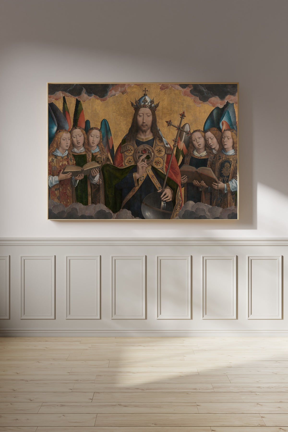 Framed art print of God the Father with Singing Angels by Hans Memling, on a panelled wall in afternoon light
