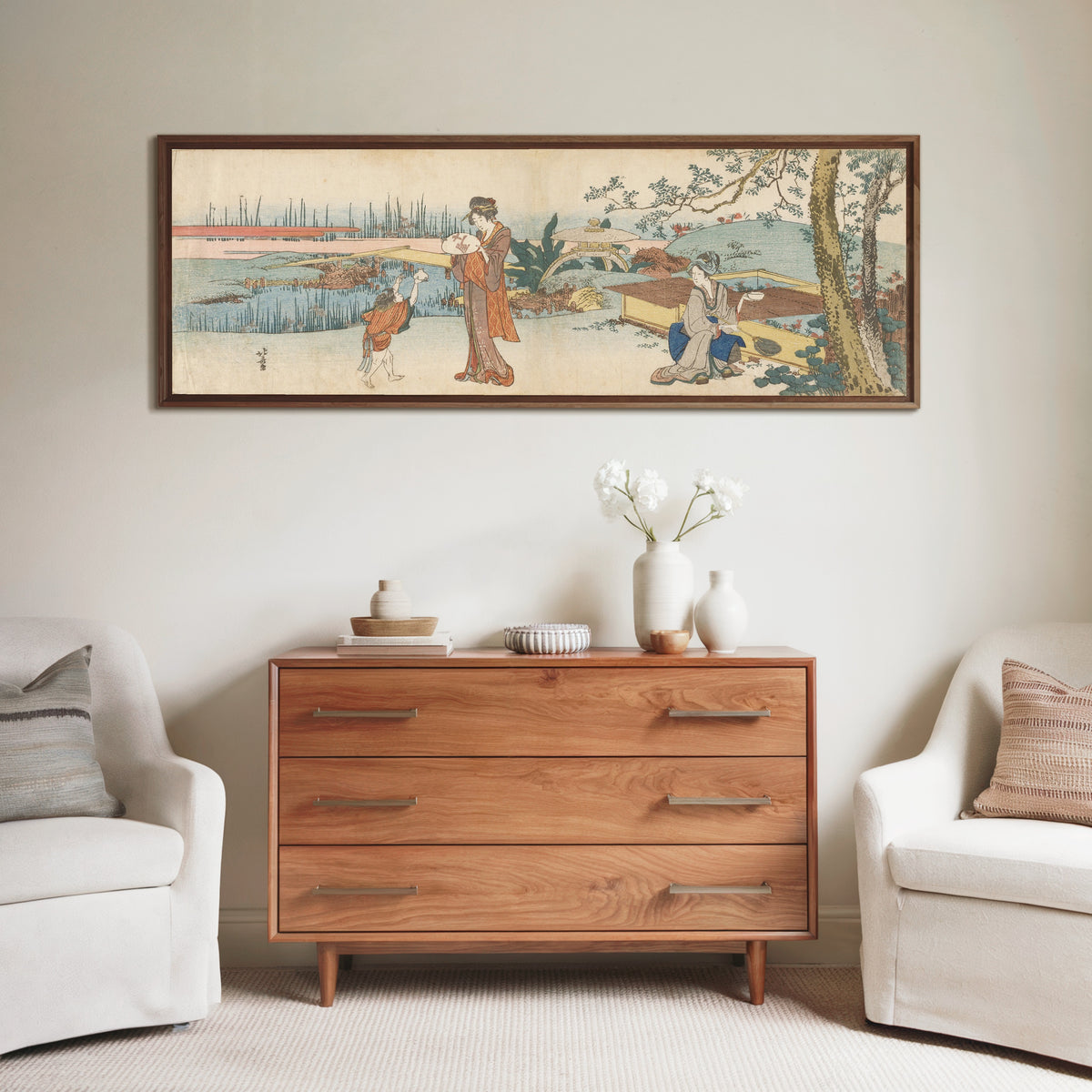 Framed art print of Goldfish Vendor by Katsushika Hokusai, above a wooden chest of drawers
